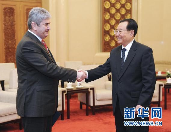 12月5日，中共中央政治局委员、全国政协副主席王刚在北京会见以执行主席奥普雷亚为团长的执政联盟成员罗马尼亚全国进步联盟代表团。新华社记者 谢环驰 摄
