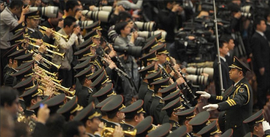 3月3日，中国人民政治协商会议第十一届全国委员会第五次会议在北京人民大会堂开幕。这是军乐团高奏国歌。 新华社记者 谢环驰 摄
