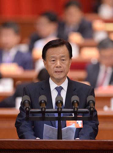 3月8日，全国政协十二届一次会议在北京人民大会堂举行第三次全体会议。这是许荣茂委员作《借鉴香港基层管理经验 推动内地“幸福社区”建设》的发言。新华社记者 王晔 摄